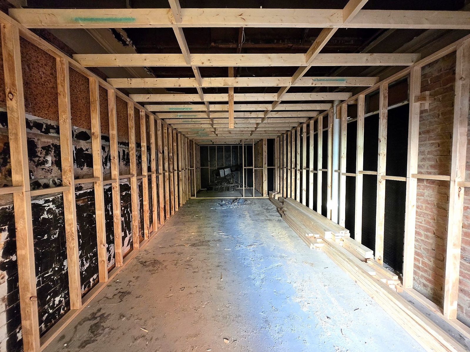 New internal timber wall framing against exposed brick in a Coburg renovation - Master Framers
