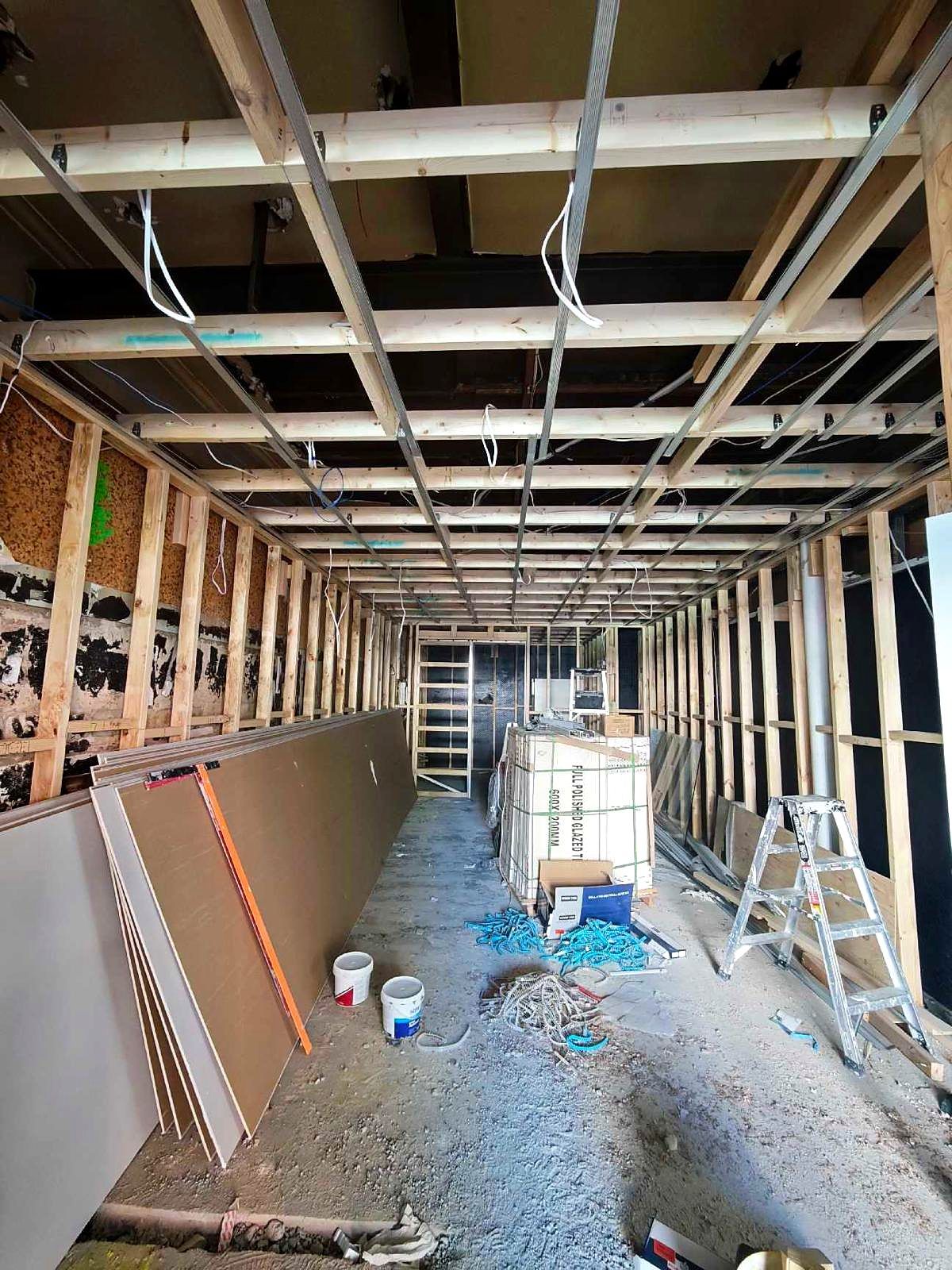 Plastering works to new framed walls in a Coburg shop renovation - Master Framers