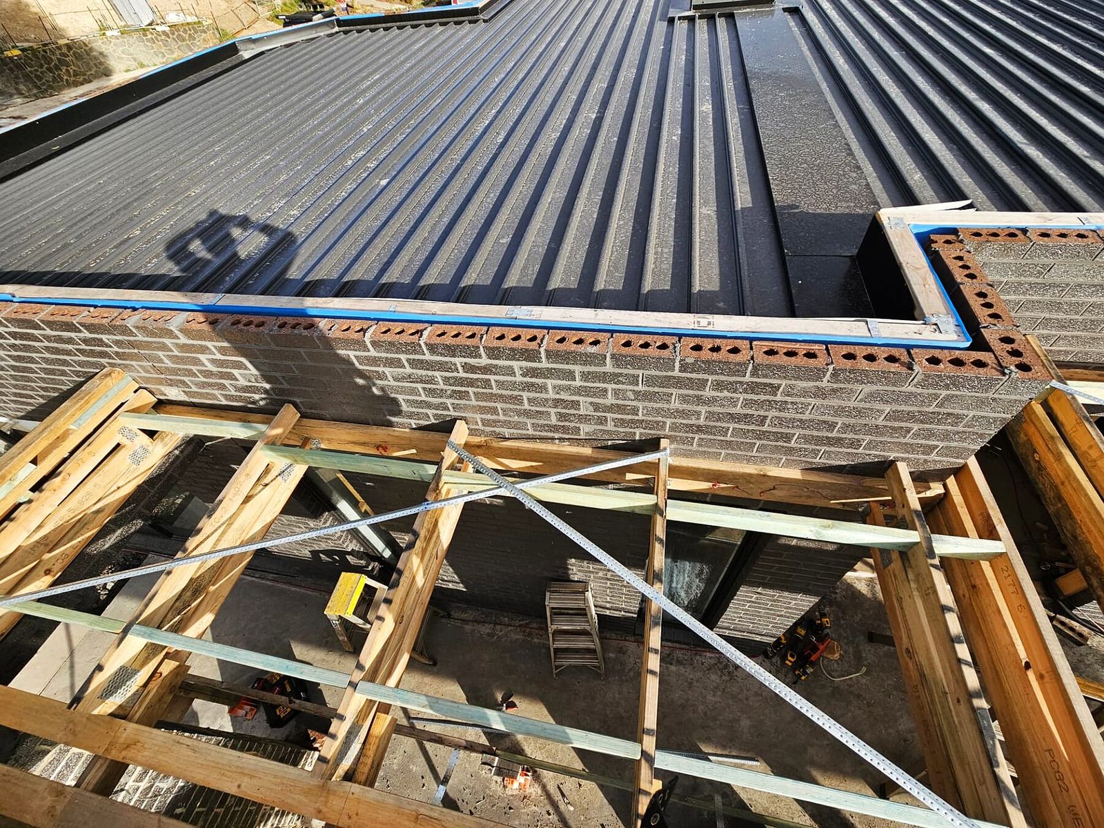 Completed metal roofing over timber framing on a Doreen custom home - Master Framers