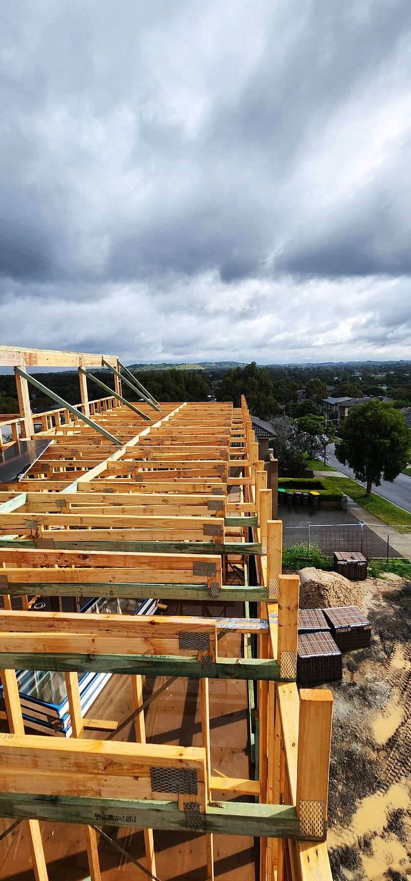 Roof framing and rafters over the upper level of a Doreen custom home - Master Framers