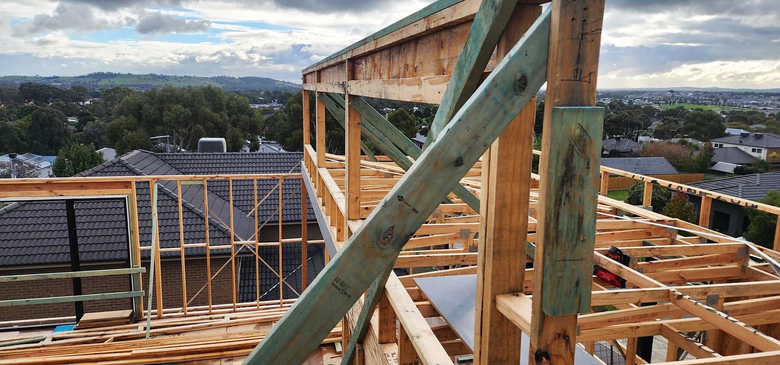 Roof framing with timber bracing on a custom home in Doreen VIC - Master Framers