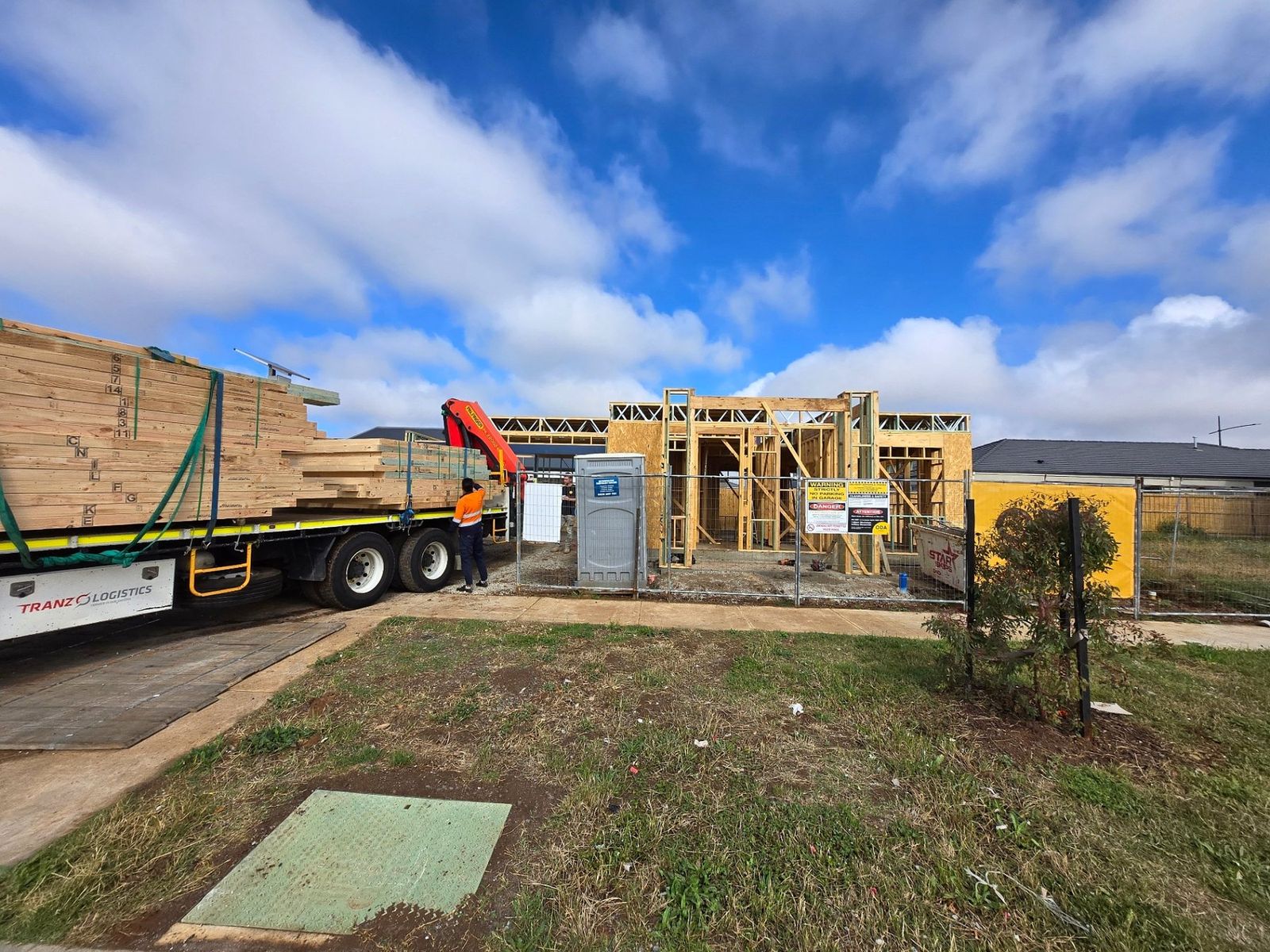 Timber wall frames delivered by crane truck to a double storey build site in Melbourne - Master Framers