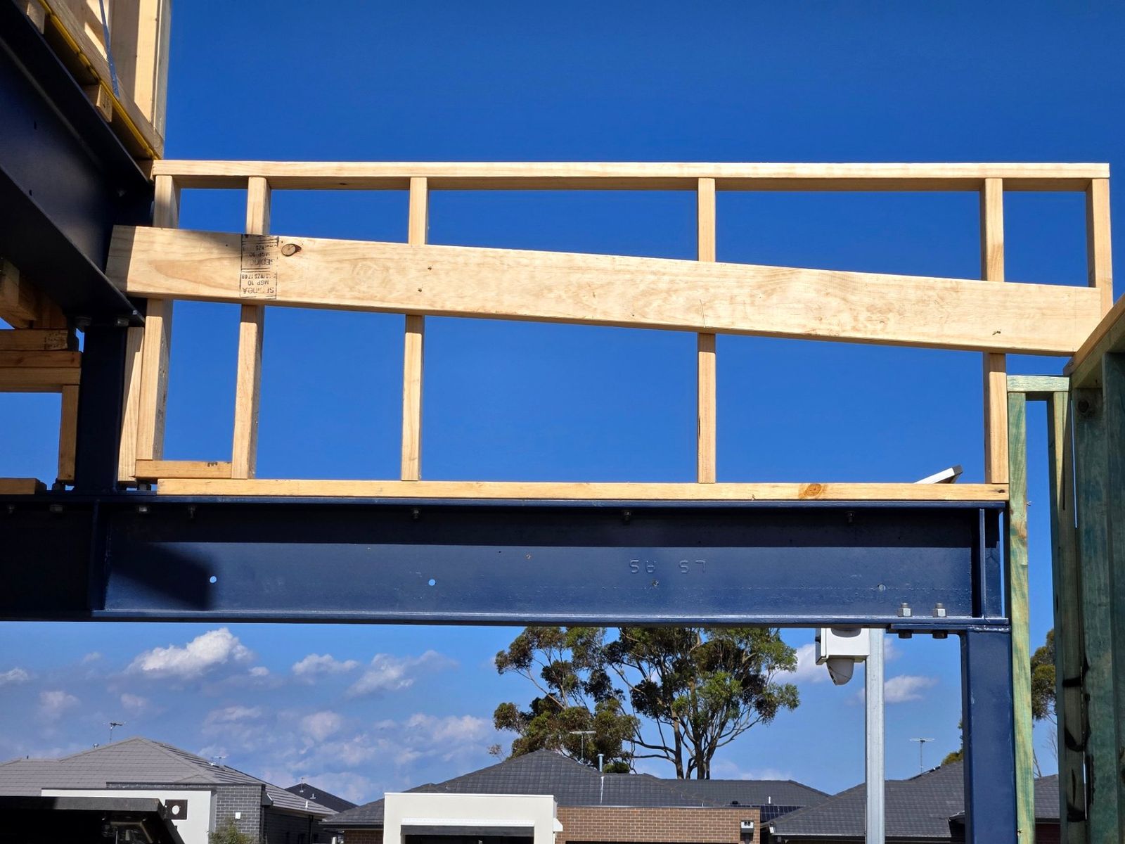 Ground floor timber wall framing over a structural steel beam on a double storey build in Melbourne - Master Framers