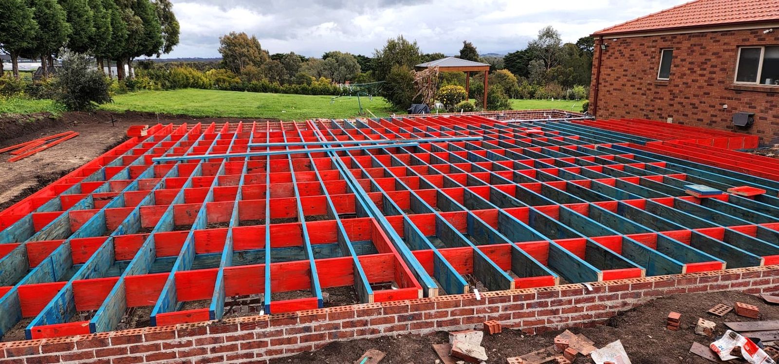 Timber subfloor framing with bearers and joists over brickwork on a Melbourne home extension - Master Framers