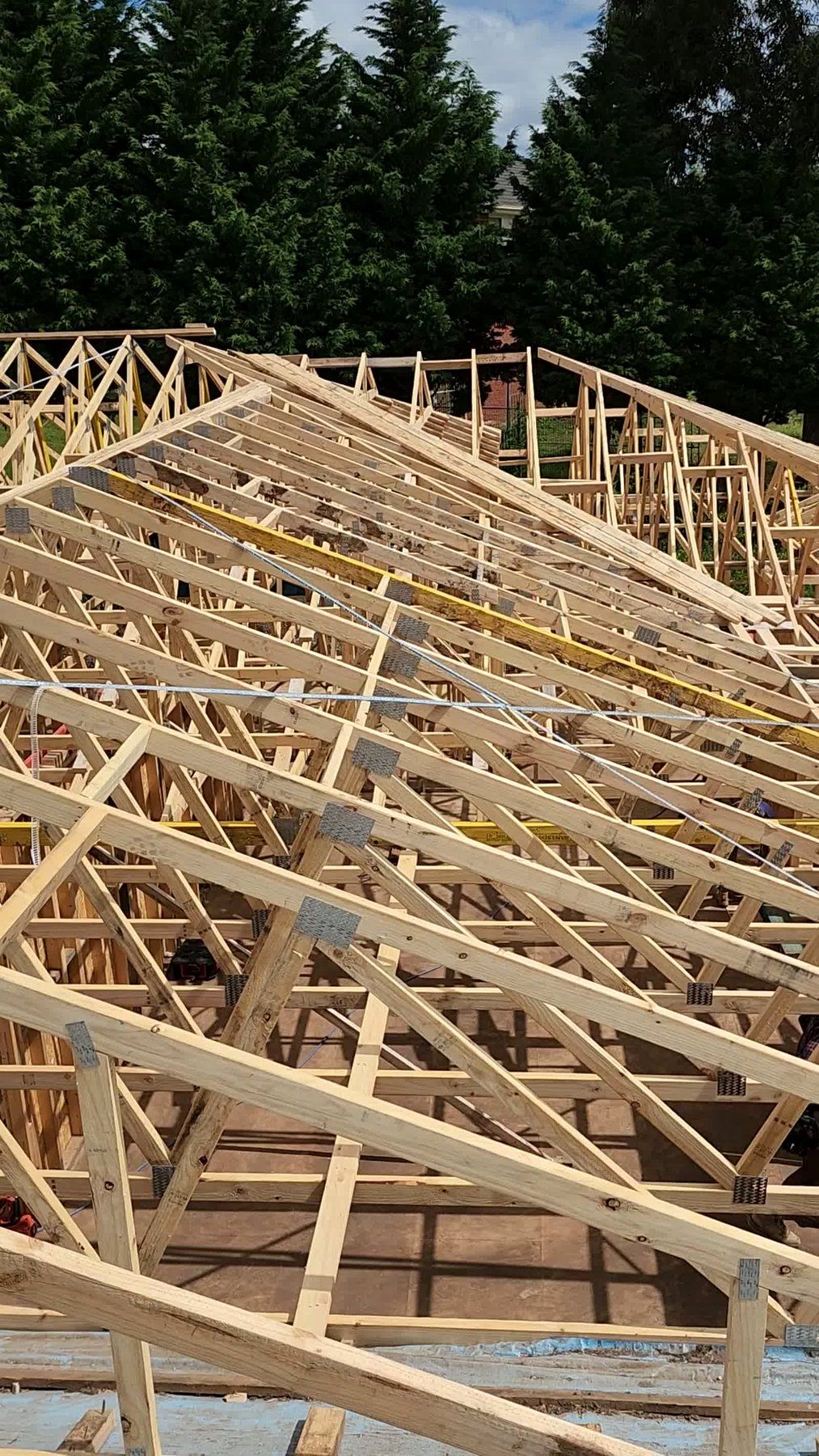Still frame showing roof trusses installed over a Melbourne home extension - Master Framers